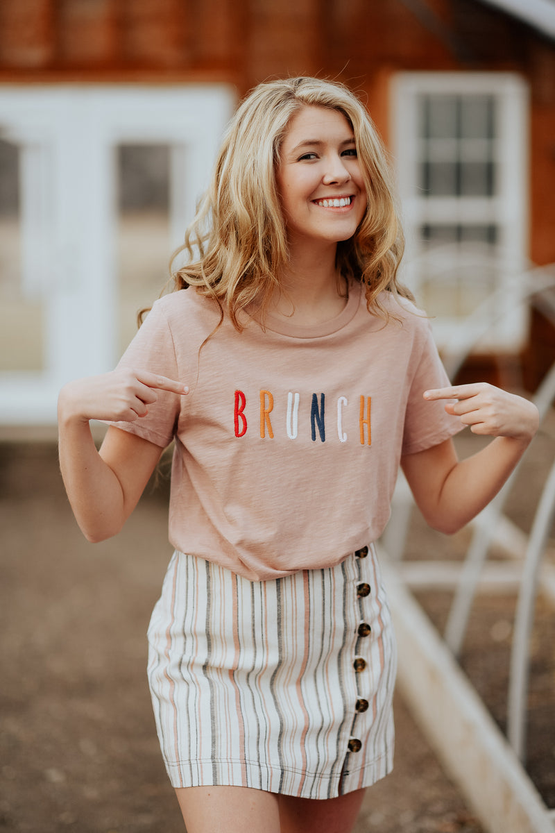 Must have mauve tee with multi-colored letters spelling BRUNCH 100% Cotton