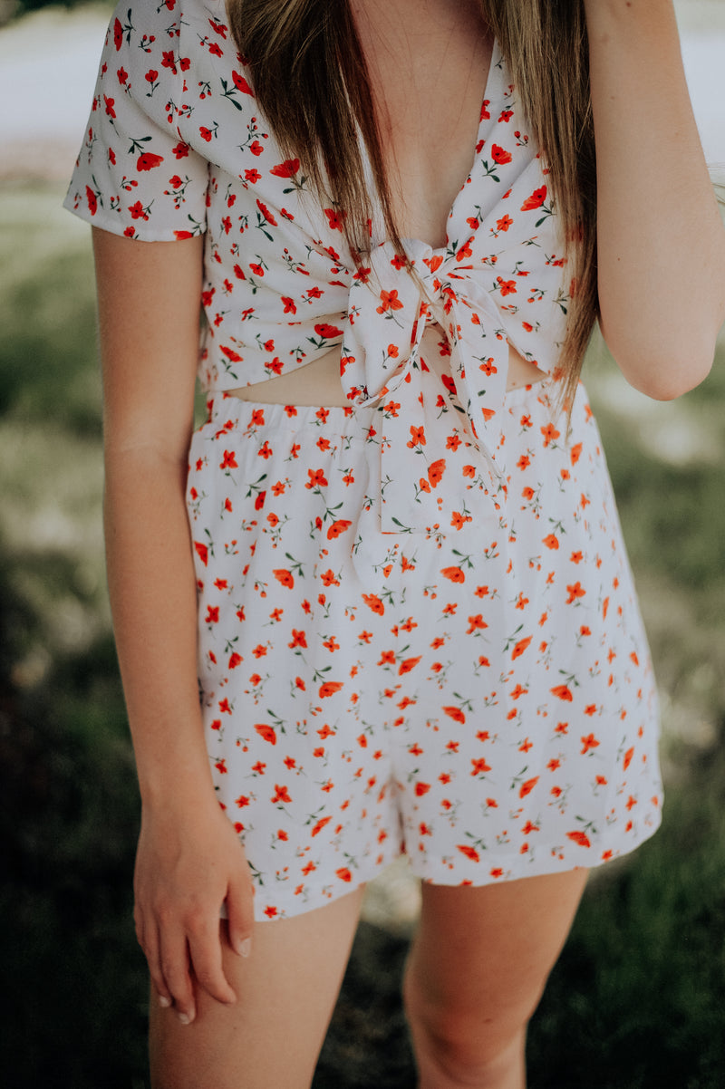 Adorable white romper with red flower design